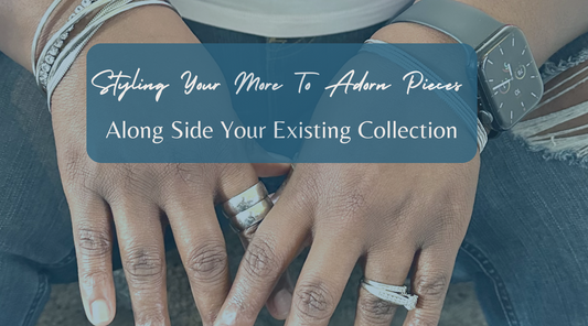 plus size woman's hands wearing silver stainless steel plus size ring in size 12 and other silver accessories.