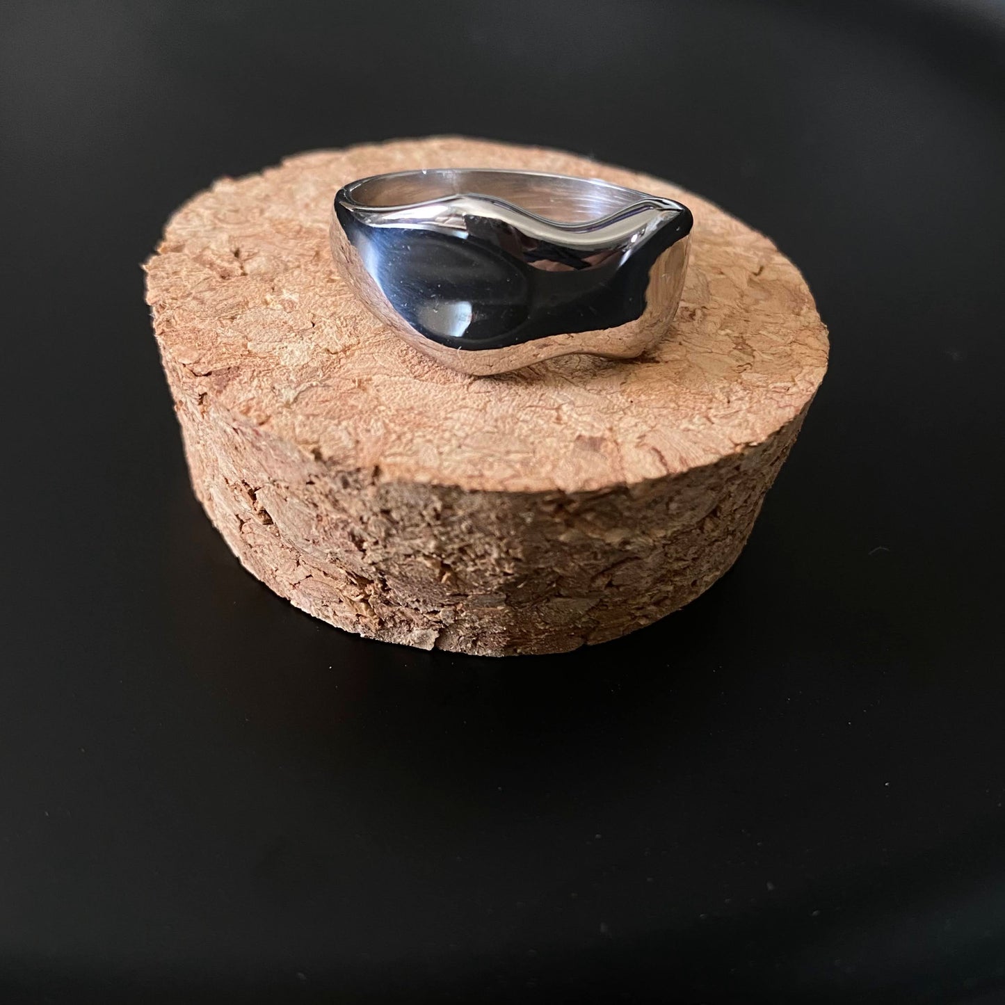 simple band-style ring that has a unique wavy shape that is similar to the curves of a woman's body plus size ring style